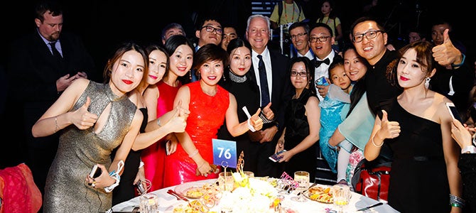 Force for Good Gala/Auction Nu Skin founders Blake Roney and Steve Lund pose for a picture with Nu Skin Distributors at the Force for Good Foundation Auction and Gala.