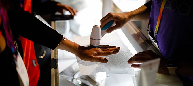 Product Experience Nu Skin distributors and customers test out the new Lumi Spa on their hands at Nu Skin LIVE!